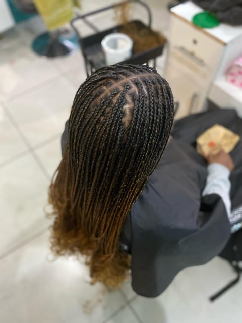 Person with long box braids