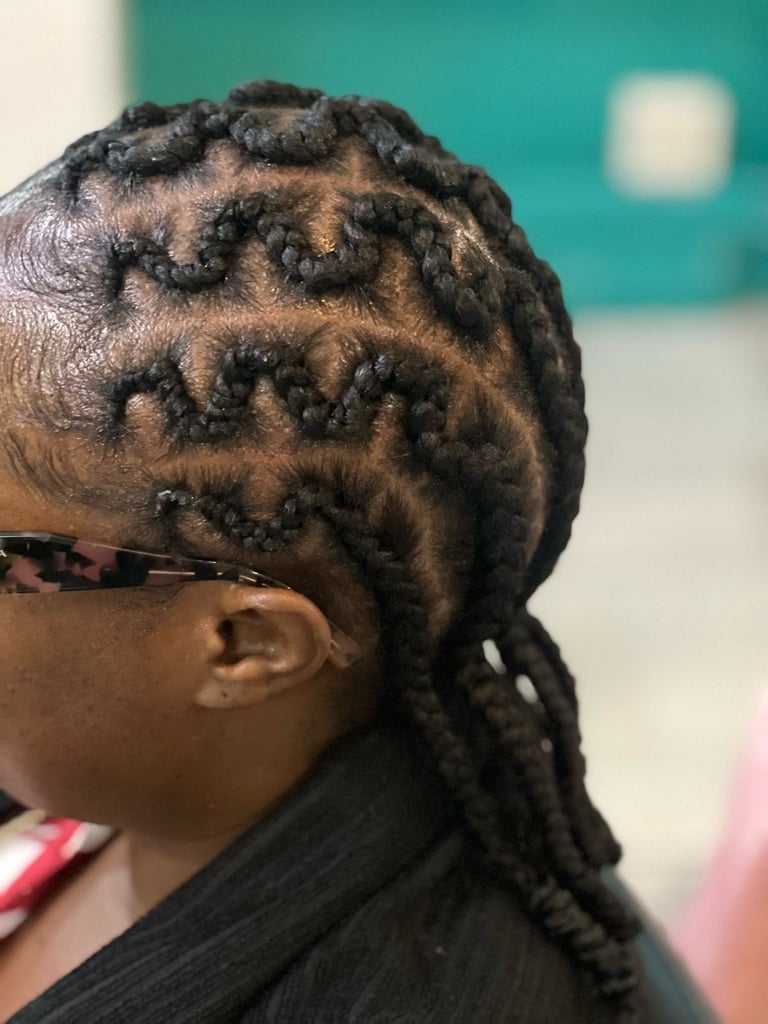 Child with intricate braided hairstyle